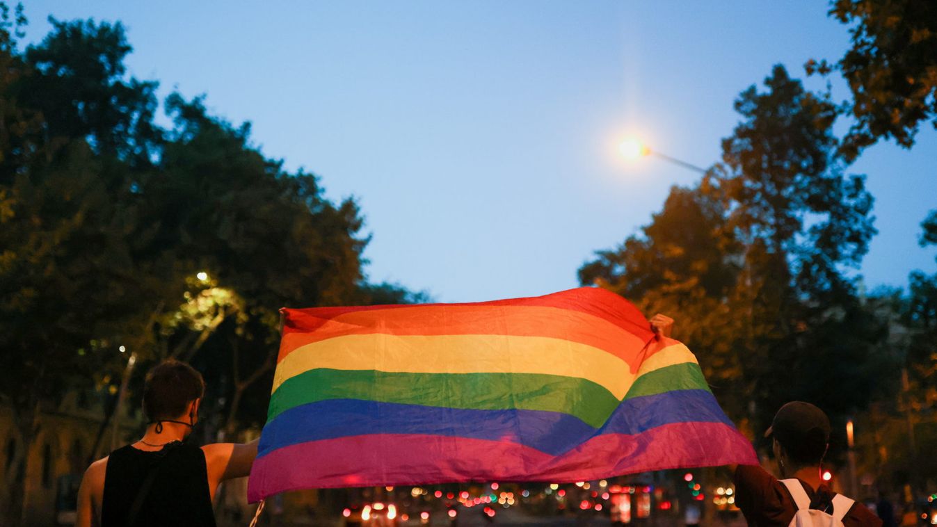Activists hold a rainbow flag as they protest over the death of Samuel Luiz, in Barcelona