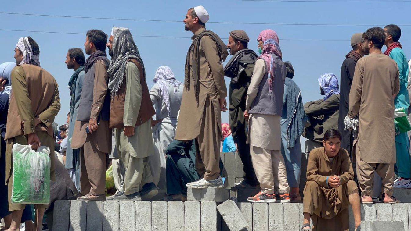 People wait to be evacuated at Kabul's Hamid Karzai Airport