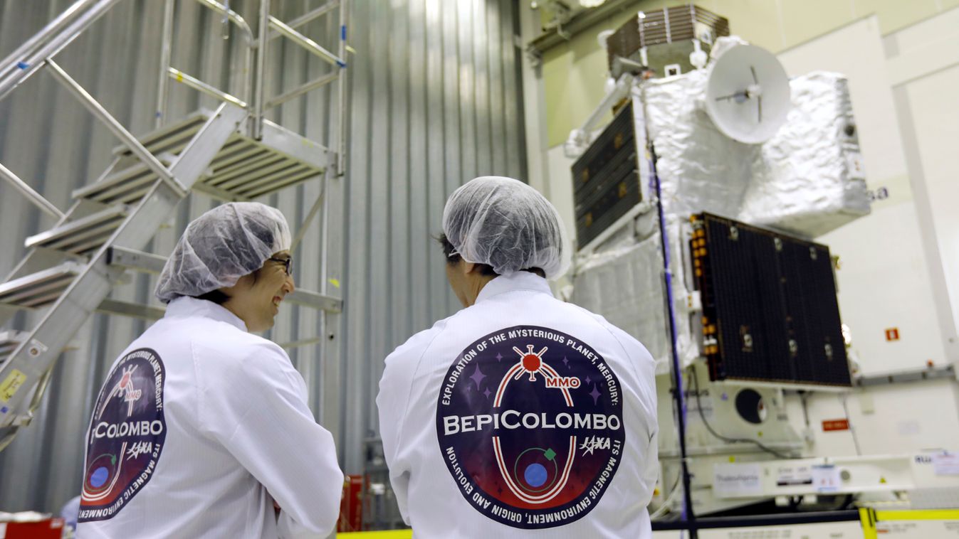 Two engineers look at BepiColombo at the ESA's ESTEC space centre, in Noordwijk