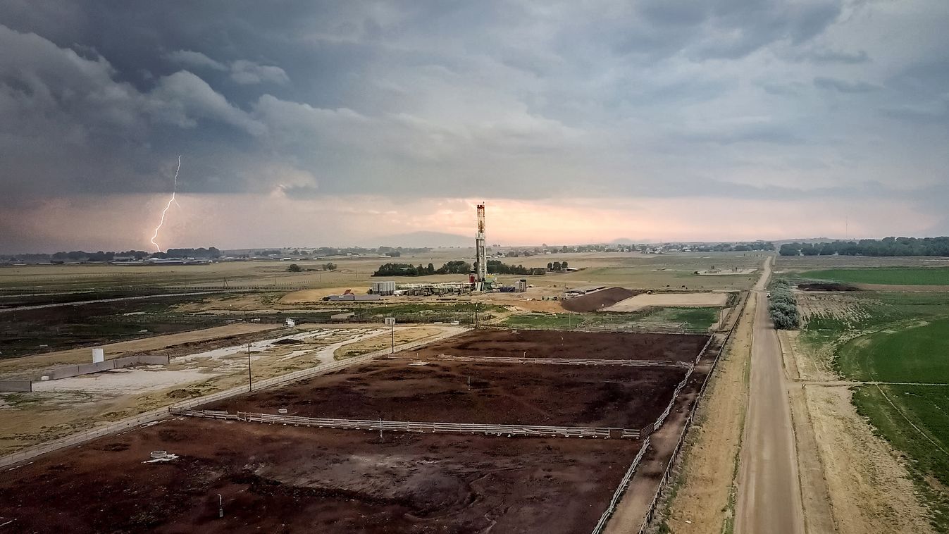 Fracking Drilling Rig Under a Dramatic Sky with Lightning