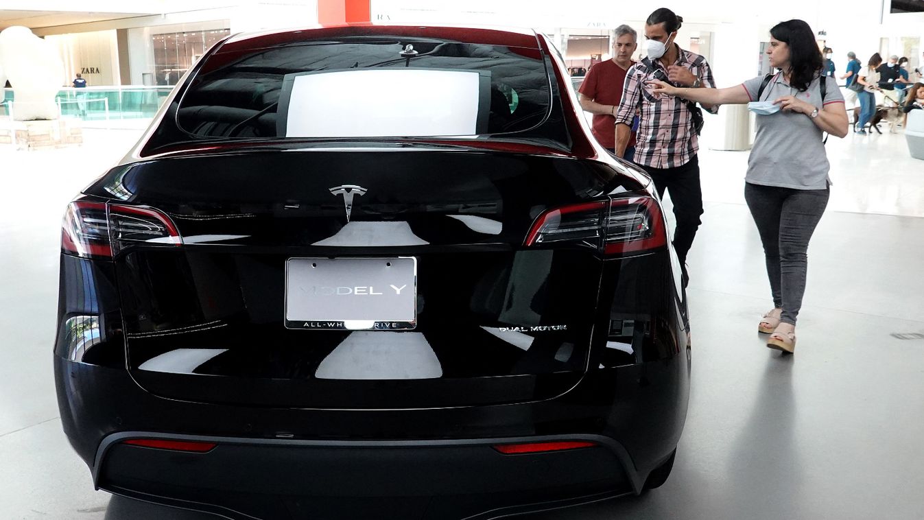 Electric Car Maker Tesla Reports Record Quarterly Earnings