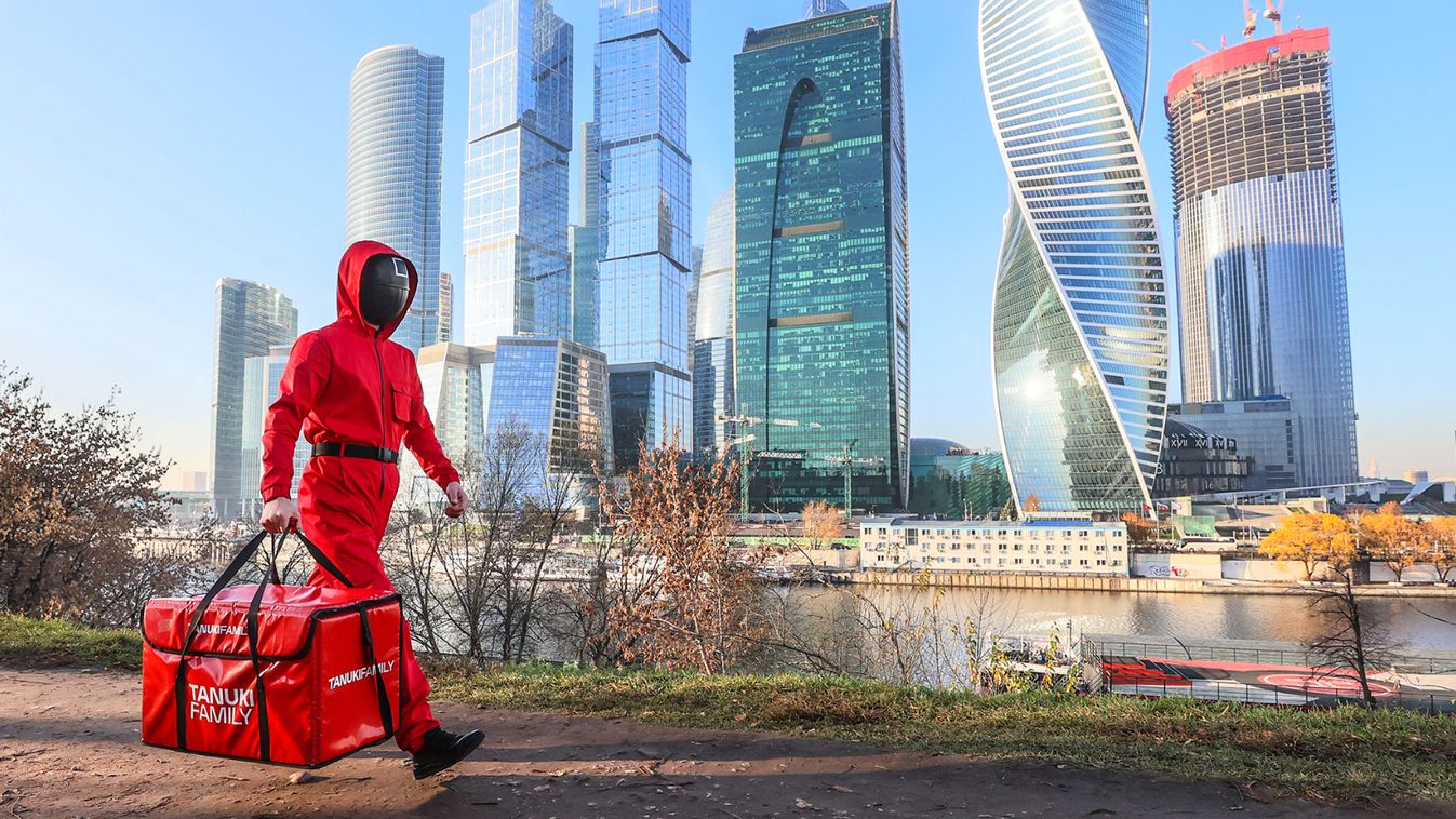 Couriers deliver orders from Moscow's Japanese restaurant Tanuki in Squid Game guard uniforms