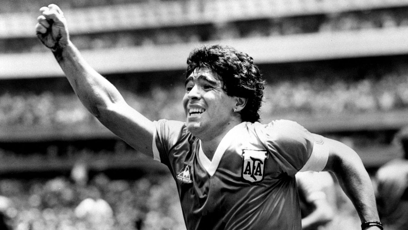 Argentinian star Diego Maradona raises his arm in the air after scoring