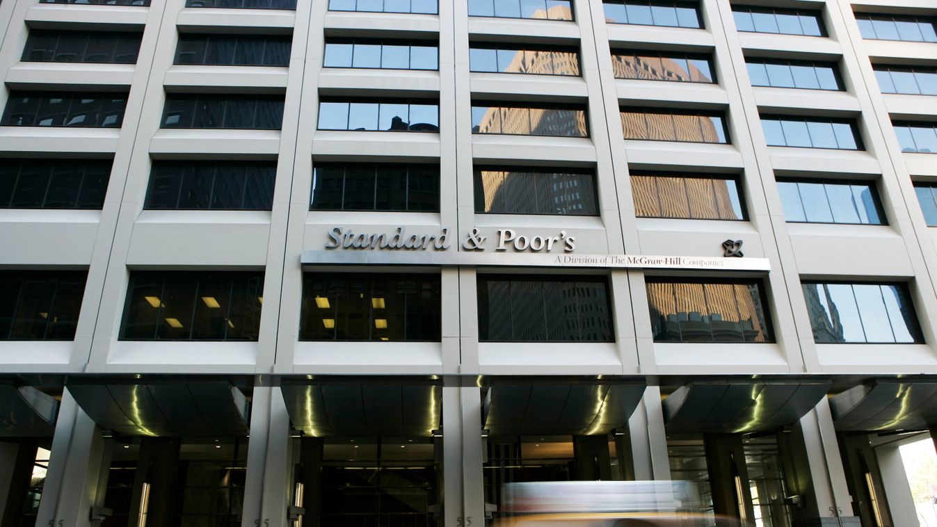 A taxi drives past Standard & Poor's Corp. headquarters in N