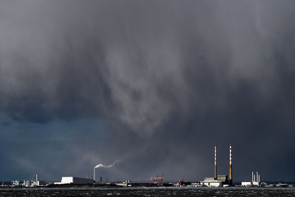 Rain clouds are seen over Poolbeg chimney stacks during Storm Eunice, in Dublin, Ireland, February 18, 2022. REUTERS/Clodagh Kilcoyne