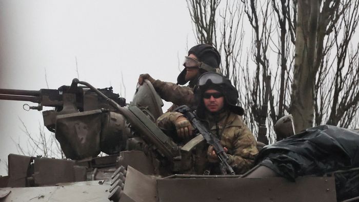 Tanks move into the city, after Russian President Vladimir Putin authorized military operation in eastern Ukraine, in Mariupol