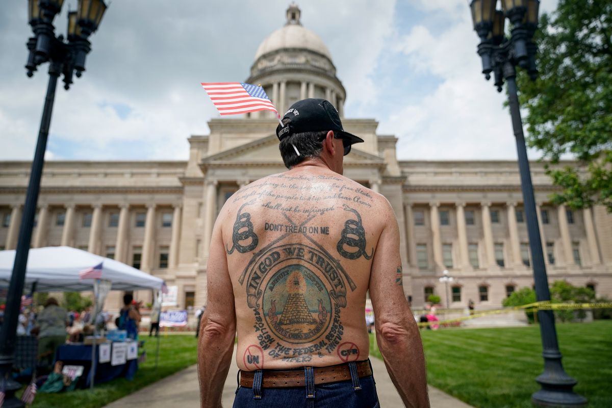 A gun rights supporter listens to a speaker during a "Patriot Day 2nd Amendment Rally" in support of gun rights at the State Capitol in Frankfort