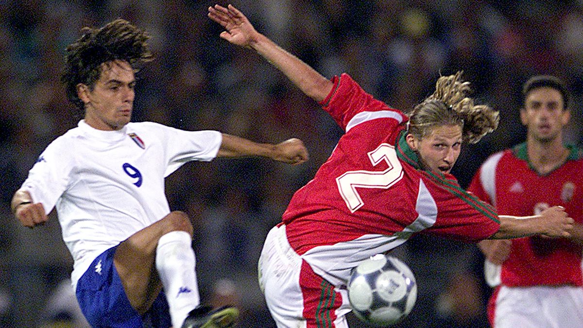 INZAGHI OF ITALY FIGHTS FOR A BALL WITH HUNGARIAN KORSOS.