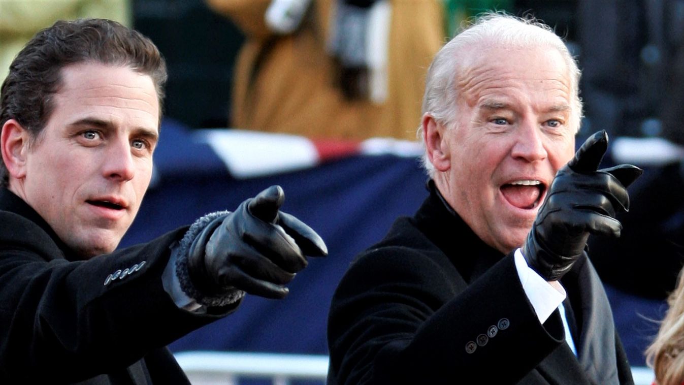 U.S. Vice President Biden and son Hunter gesture as they walk down Pennsylvania Avenue