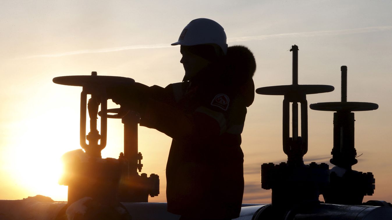 Worker checks valve of oil pipe at Lukoil company owned Imilorskoye oil field outside West Siberian city of Kogalym