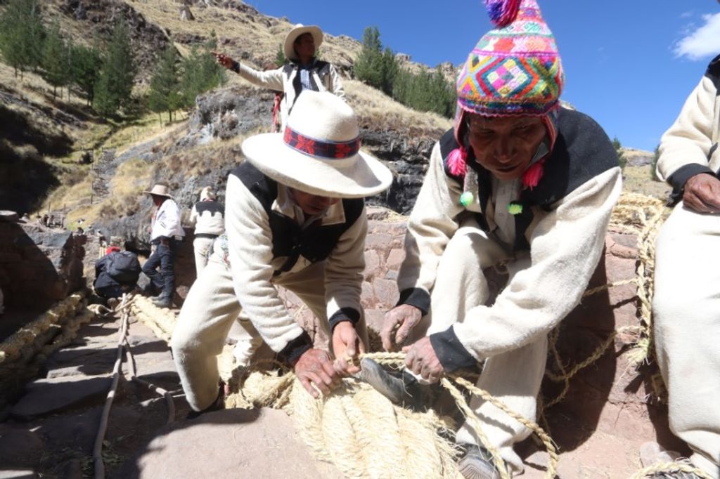 Members of the Huinchiri community rebuild the Qeswachaka bridge in Canas province