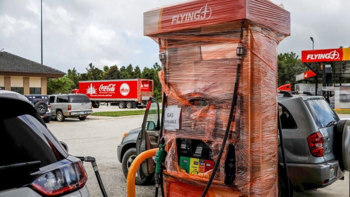 A plastic-wrapped gas dispenser with a sign that reads "Gas available" is seen ahead of the arrival of Hurricane Dorian in St. Augustine