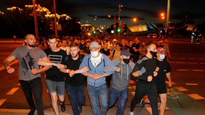 Clashes with opposition supporters after polls closed at the presidential election in Minsk