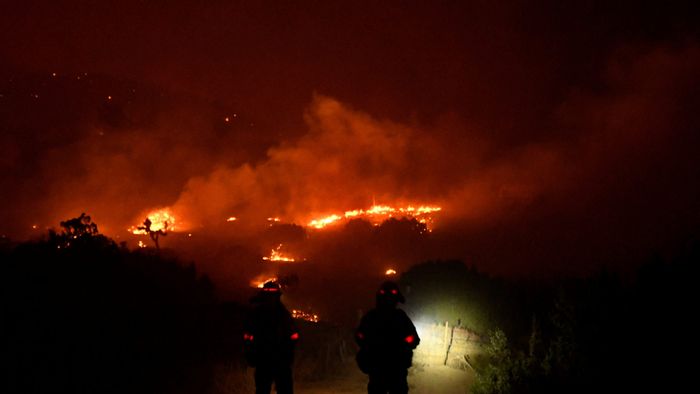 Wildfire in California burns through the night north of Los Angeles