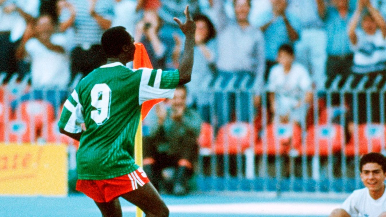 NAPLES, ITALY - JUNE 23: Roger Milla of Cameroon celebrates scoring his first goal during the World Cup eighth final match between Cameroon and Colombia at the San Paolo Stadium on June 23, 1990 in Naples, Italy. (Photo by Henri Szwarc/Bongarts/Getty Images)