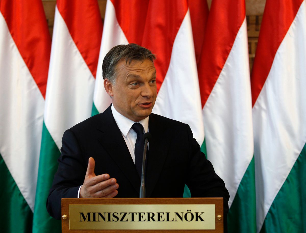 Hungary's PM Orban gestures as he make a press statement in Budapest