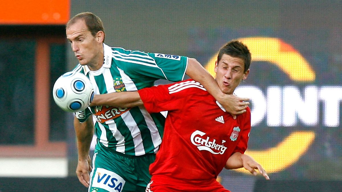Rapid's Juergen Patocka (L) challenges Liverpool's Krisztian Nemeth during their friendly soccer match