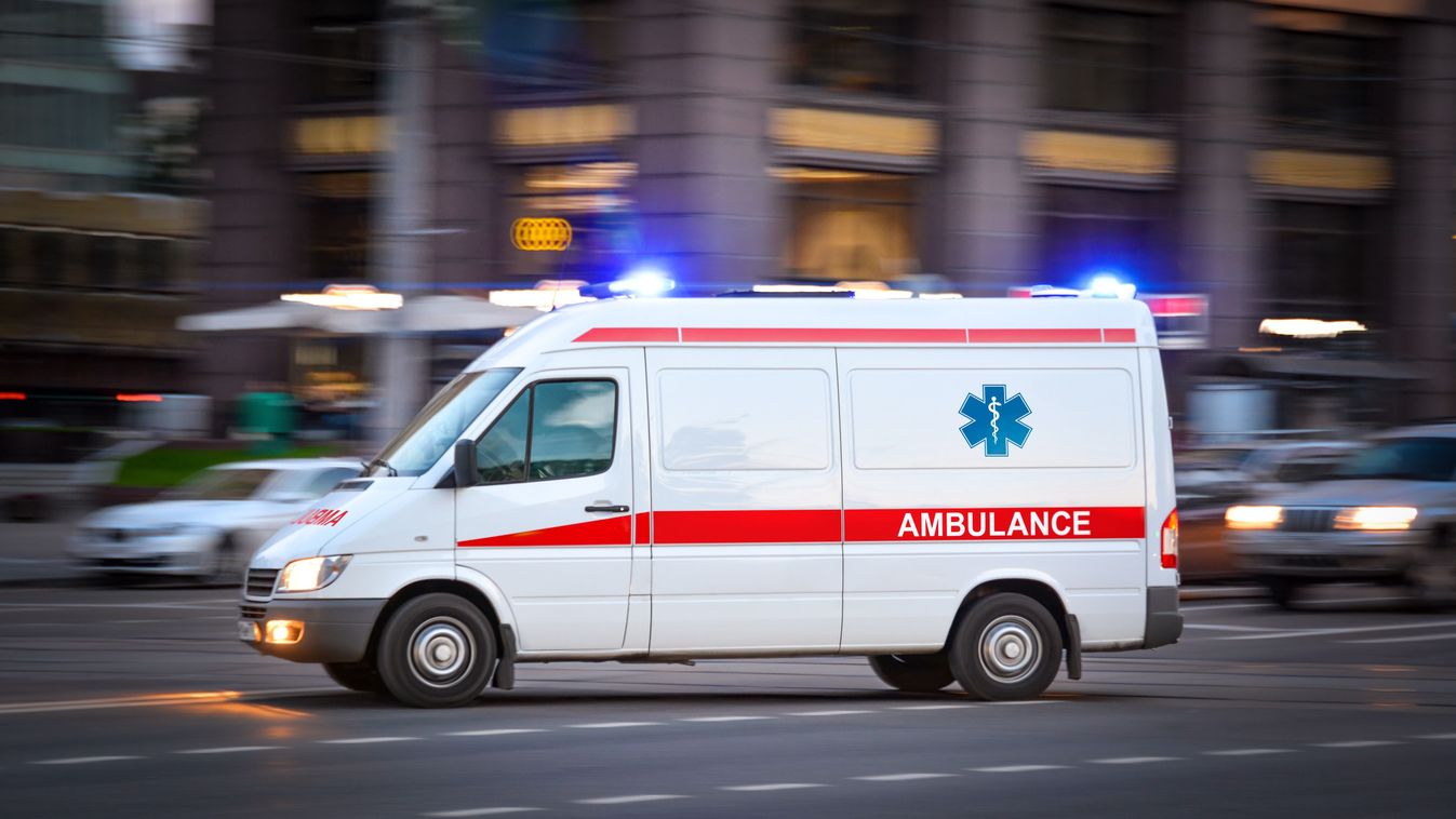 Ambulance,Van,On,A,Wide,City,Street.,White,Emergency,Vehicle