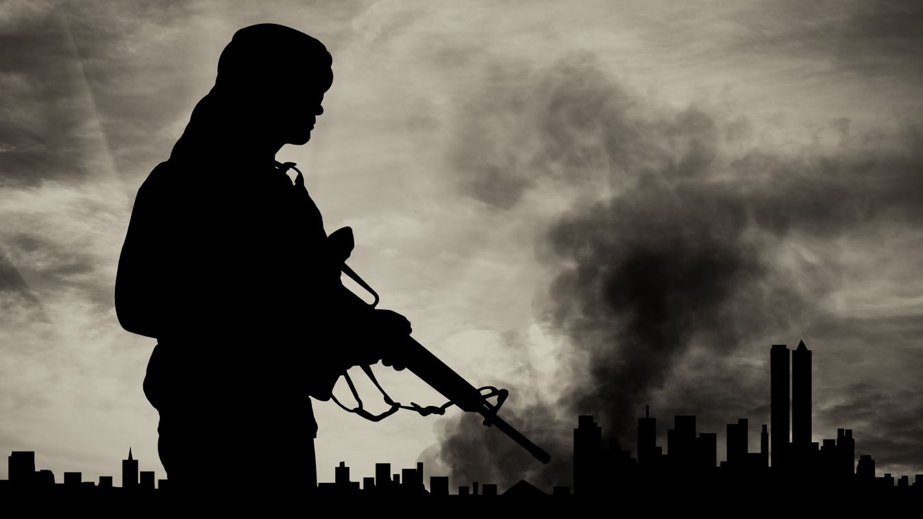 Concept,Of,Terrorism.,Silhouette,Terrorist,On,City,Background,In,Smoke