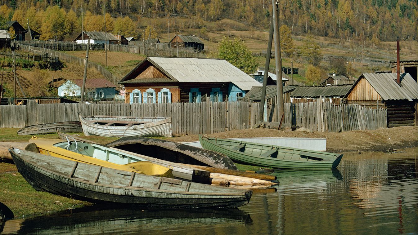 Boats pulled out of water and wooden houses, Listvenitshnoie village, Siberia, Russia, Europe