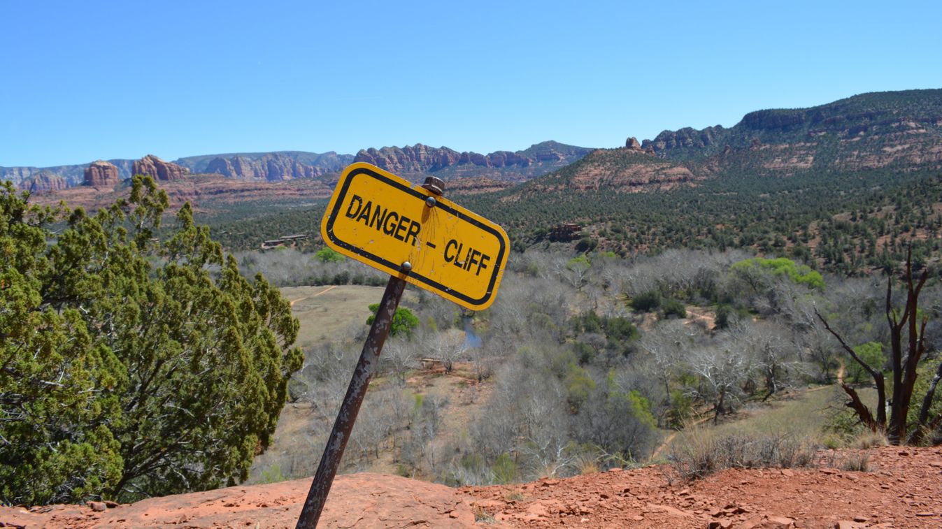 A,Yellow,Warning,Sign,On,A,Hiking,Trail,In,Sedona,