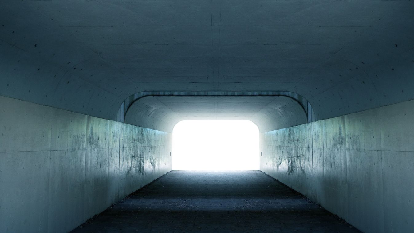 Inside,A,Tunnel,With,Light,Coming,In,From,The,Exit