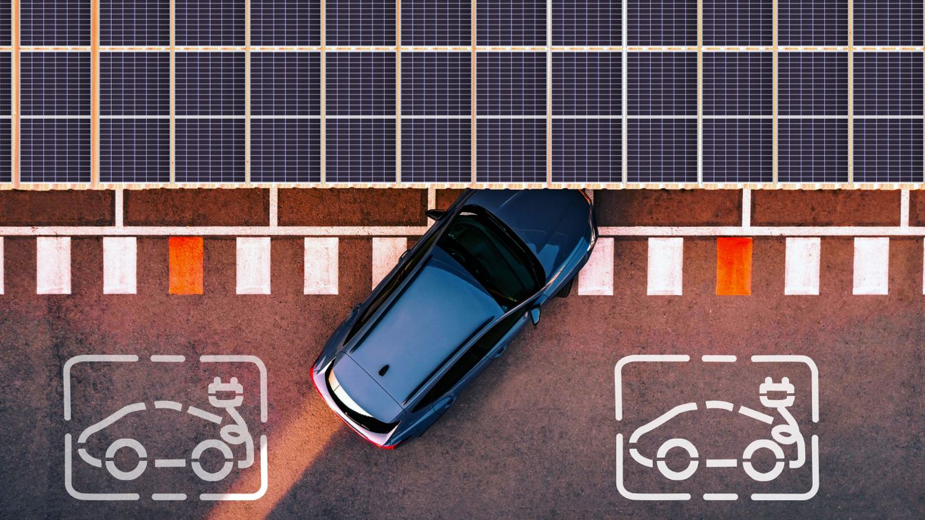 Aerial view of electric car parking in charging station with solar panels.
Lugas