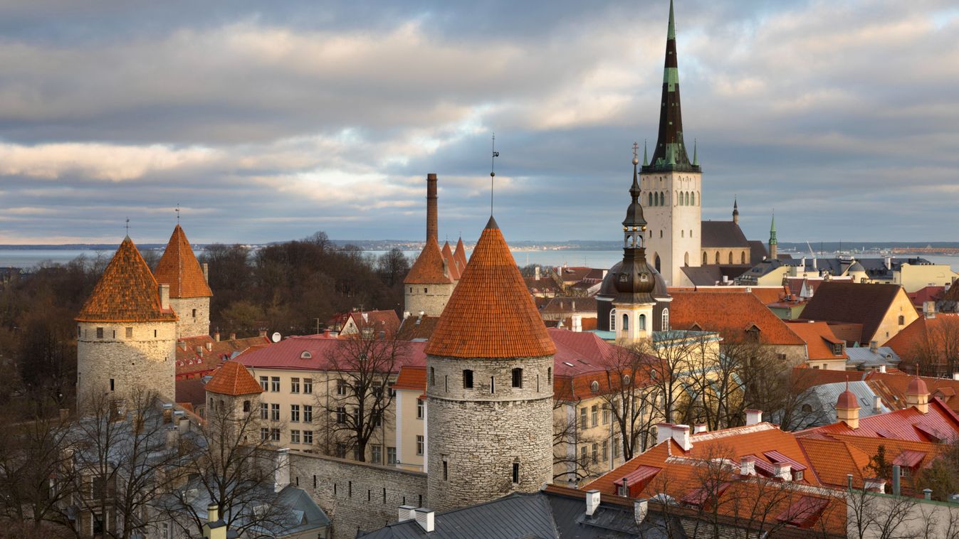 View over the Old Town with the City Walls and Oleviste Church from Patkuli Viewing Platform, Old Town, Tallinn, Estonia, Europe