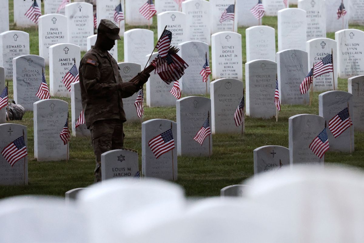 Annual Flags-In Event Held At Arlington Cemetery Ahead Of Memorial Day