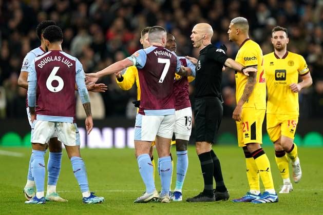 Aston Villa v Sheffield United - Premier League - Villa Park Referee Anthony Taylor attempts to take control after Aston VAR