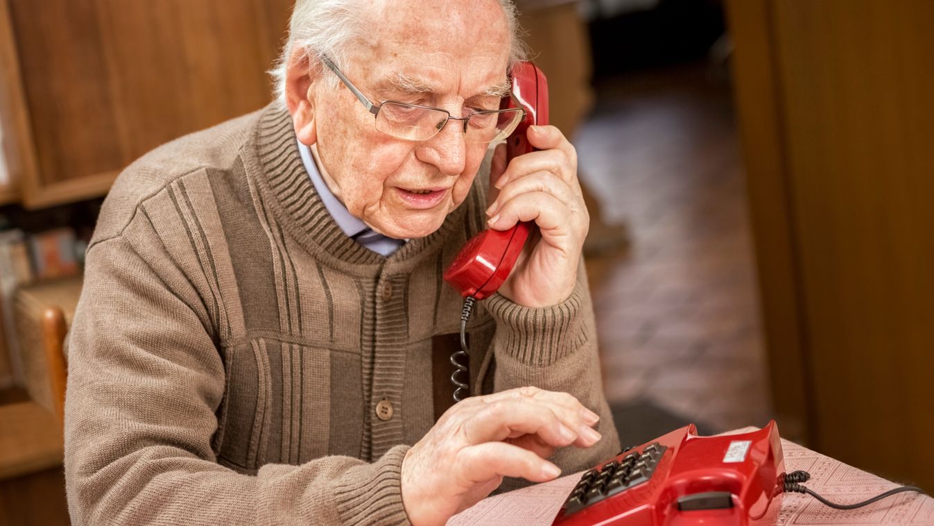 Grandfather,With,Old,Red,Button,Telephone