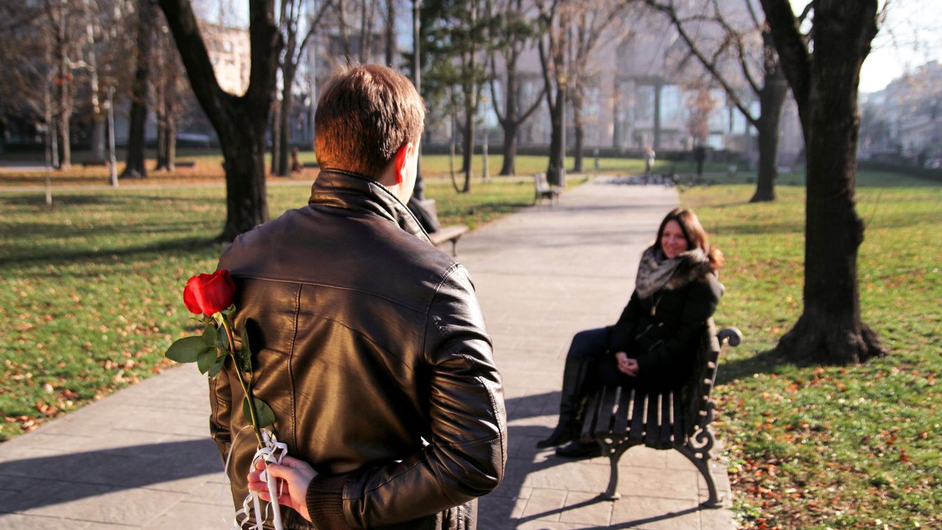 Couple,On,Valentines,Day.,Girl,Sitting,On,A,Bench,In