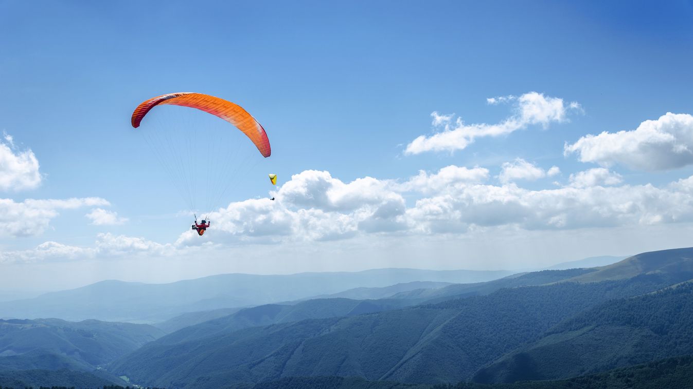 Paraglider,In,The,Blue,Sky.,The,Sportsman,Flying,On,A