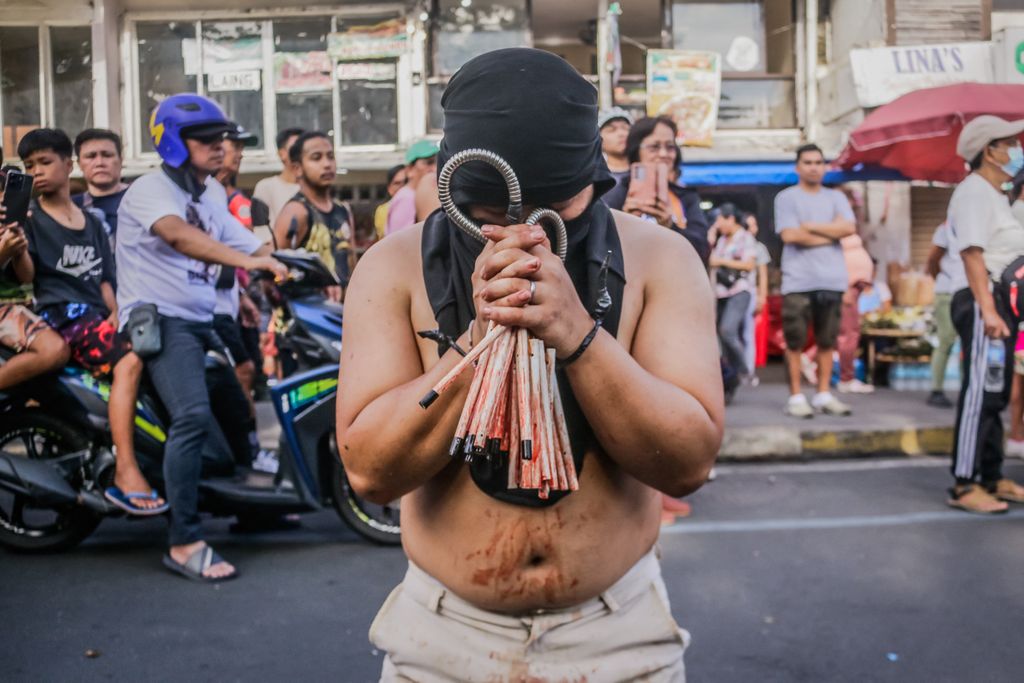 Good Friday Tradition In Philippines
A Catholic penitent is self-flagellating in the street in Antipolo City, Philippines, on Good Friday, March 29, 2024. Self-flagellation in the Philippines is part of a religious ceremony to atone for past sins. The Catholic Church disapproves of the practice, considering it an extreme misinterpretation of faith. (Photo by Ryan Eduard Benaid/NurPhoto) (Photo by Ryan Eduard Benaid / NurPhoto / NurPhoto via AFP)