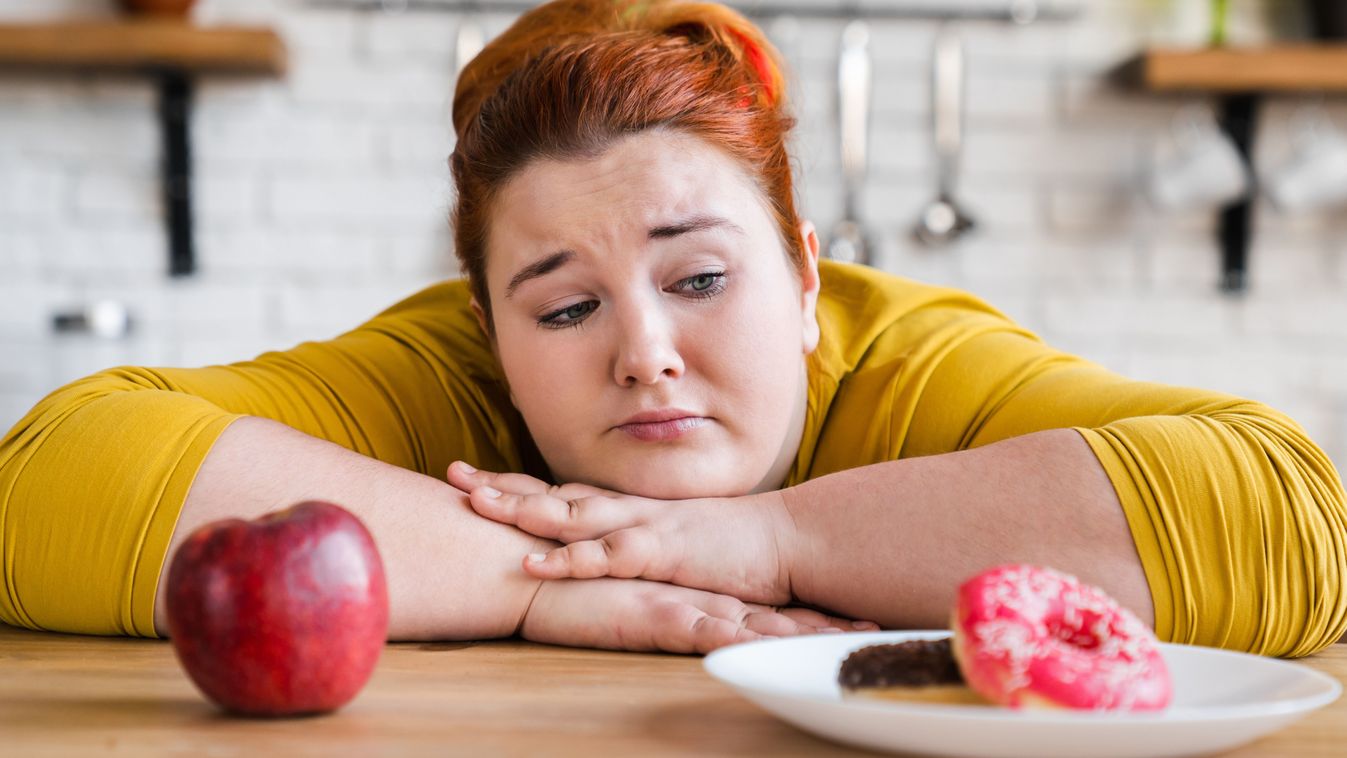 Sad,Plump,Fat,Woman,Choosing,Between,Sweets,And,Fruits,,Healthy, elhízott, kövér, elhízás, alma, diéta, 