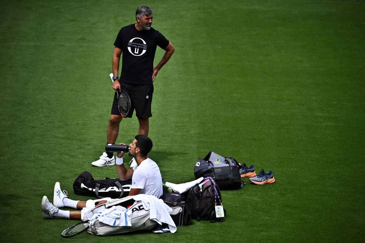 Serbia's Novak Djokovic speaks with his coach Goran Ivanisevic as he takes part in a training session at the All England Lawn Tennis Club in west London on June 27, 2023 the week before the Wimbledon Championships tennis tournament are due to start on July 3. (Photo by Ben Stansall / AFP)
