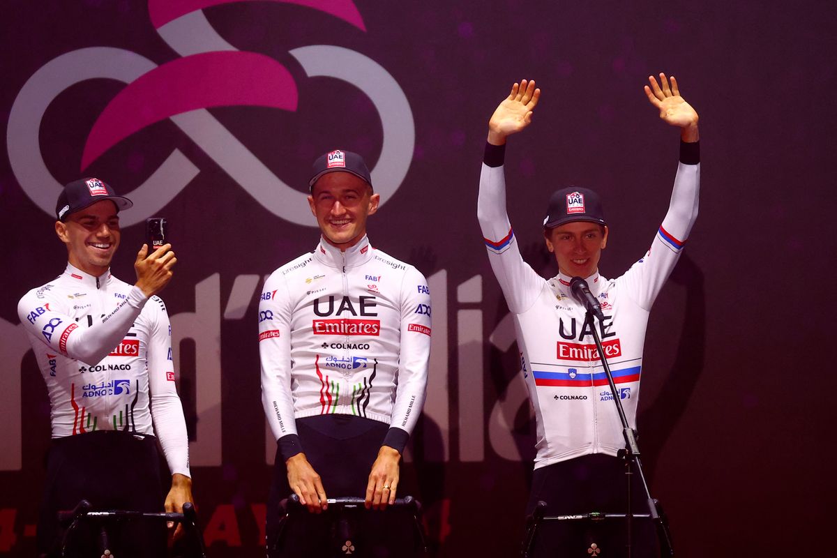 Team UAE's Slovenian rider Tadej Pogacar waves on stage during the opening ceremony and team presentation in Turin, on May 2, 2024, two days before the departure of the Giro d'Italia 2023 cycling race. The Giro d'Italia 2024 cycling race will depart from Venaria Reale near Turin on May 4, and finish in Rome on May 26. (Photo by Luca BETTINI / AFP) ( Valter Attila )