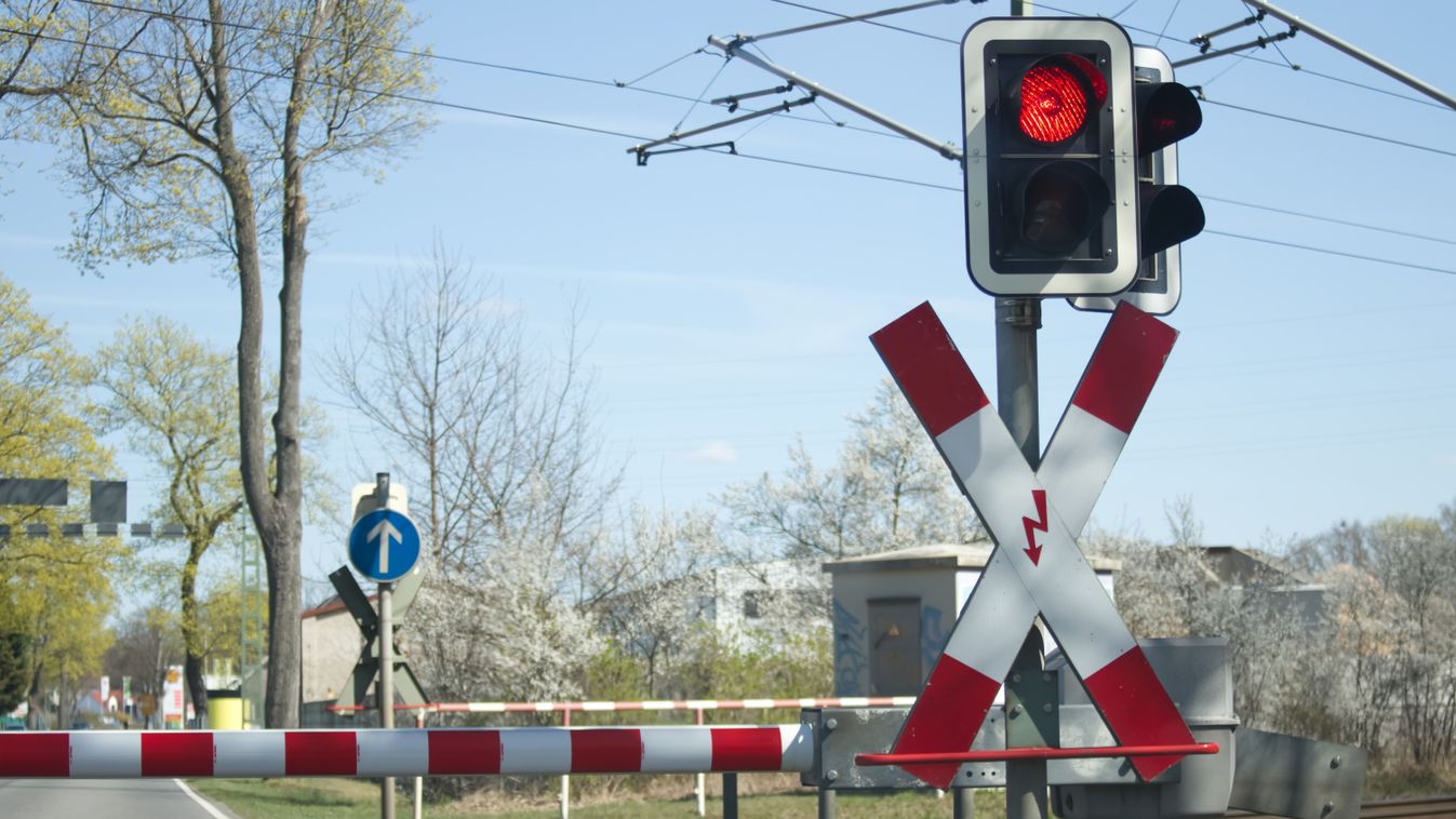 Red,Light,Of,The,Railway,Crossing,And,Lowered,Barrier,Blocking