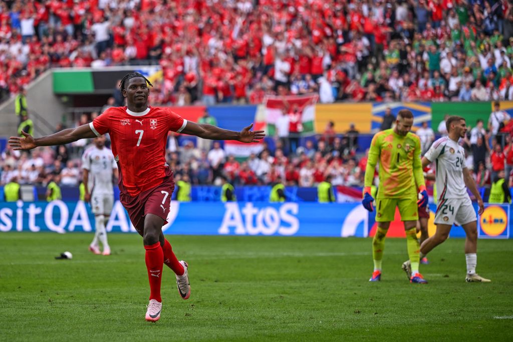 Euro 2024: Hungary - Switzerland
15 June 2024, North Rhine-Westphalia, Cologne: Soccer, European Championship, Hungary - Switzerland, Preliminary round, Group A, Matchday 1, Cologne Stadium, Breel Embolo of Switzerland celebrates after his goal for 1-3. Photo: Marius Becker/dpa (Photo by MARIUS BECKER / DPA / dpa Picture-Alliance via AFP)