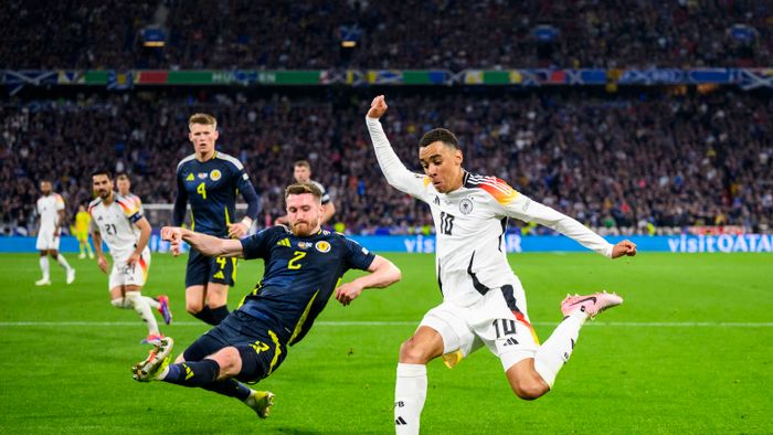 Euro2024: Germany - Scotland
14 June 2024, Bavaria, Munich: Soccer: UEFA Euro 2024, European Championship, Germany - Scotland, preliminary round, Group A, matchday 1, Munich Football Arena, Germany's Jamal Musiala (r) in action against Scotland's Anthony Ralston (l). Photo: Tom Weller/dpa (Photo by Tom Weller / DPA / dpa Picture-Alliance via AFP)