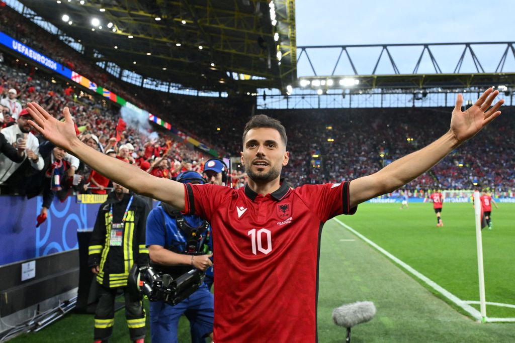 Football: UEFA Euro 2024 - 1st round day 1: Group B Italy v Albania
Albania's midfielder #10 Nedim Bajrami celebrates scoring his team's first goal during the UEFA Euro 2024 Group B football match between Italy and Albania at the BVB Stadion in Dortmund on June 15, 2024. (Photo by Alberto PIZZOLI / AFP)
