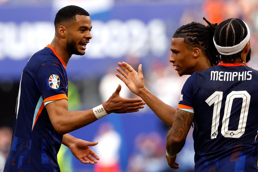 Football: UEFA Euro 2024 - 1st round day 1: Group D Poland v Netherlands
Netherlands' forward #11 Cody Gakpo (L) celebrates with Netherlands' defender #05 Nathan Ake (2nd R) and Netherlands' forward #10 Memphis Depay (R) after scoring his team's first goal during the UEFA Euro 2024 Group D football match between Poland and the Netherlands at the Volksparkstadion in Hamburg on June 16, 2024. (Photo by Odd ANDERSEN / AFP)