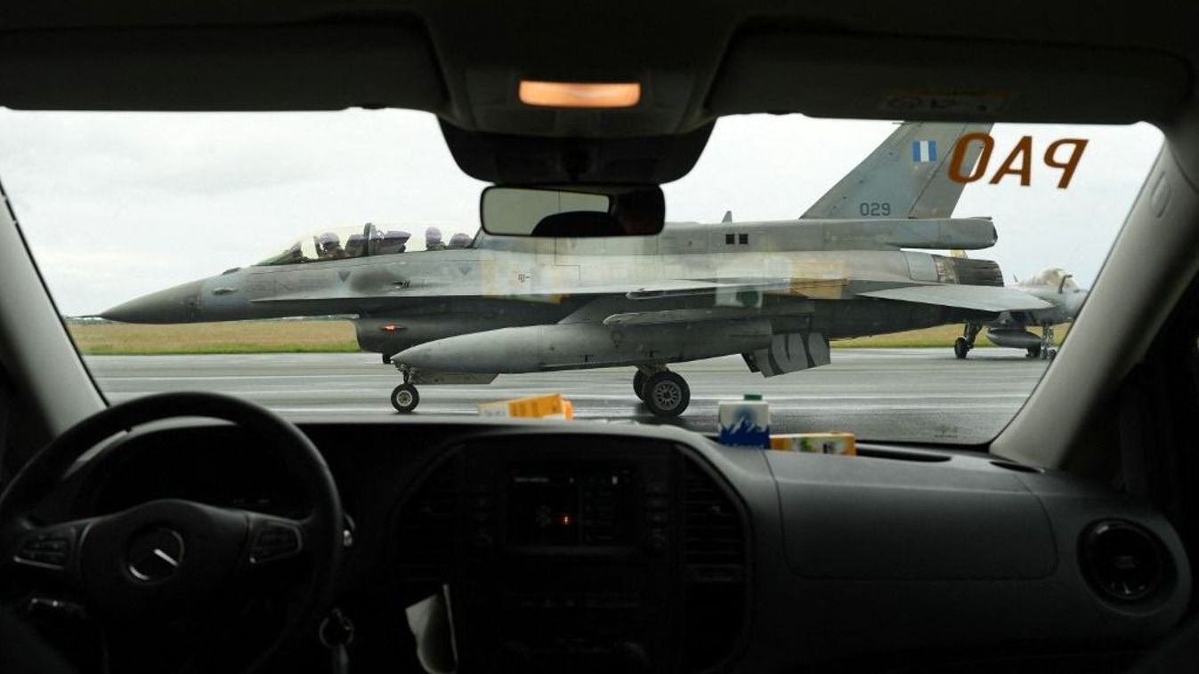 NATO air force maneuver "Tiger Meet"
11 June 2024, Schleswig-Holstein, Jagel: An F-16 fighter jet taxis past a car for take-off during the NATO air force maneuver "Tiger Meet" on the grounds of Tactical Air Force Wing 51 "Immelmann". Eleven NATO nations as well as Switzerland and Austria are taking part in the NATO "Tiger Meet" exercise. Around 60 jets and helicopters are expected to take part in June. Around 1100 additional soldiers will be on site. Tactical Air Force Wing 51 "Immelmann" is celebrating its 30th anniversary as part of this major exercise. Photo: Marcus Brandt/dpa (Photo by MARCUS BRANDT / DPA / dpa Picture-Alliance via AFP)