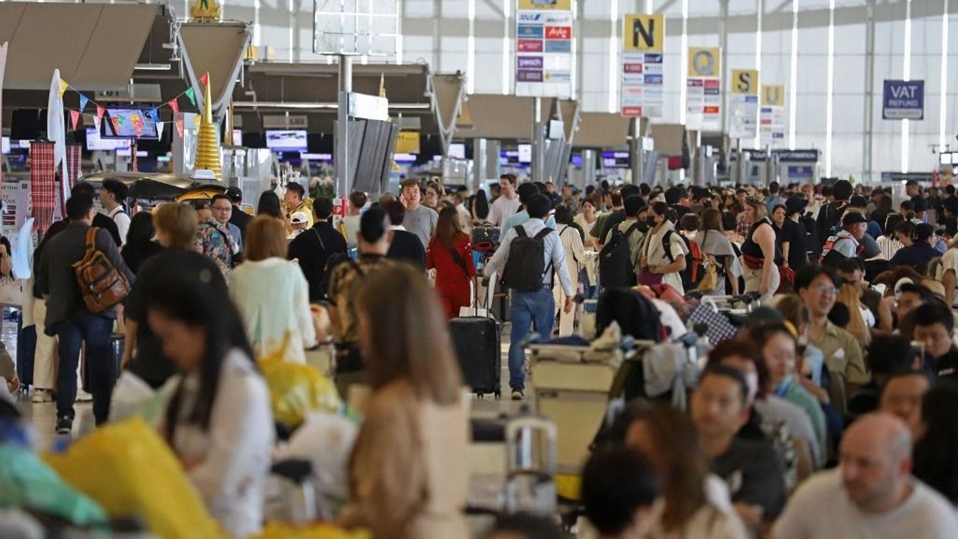 Outbound travellers are pictured at the passenger terminal of Suvarnabhumi airport during the Songkran festival on April 11, 2024 in Samut Prakan province, Thailand. BANGKOK POST PHOTO/Varuth Hirunyatheb (Photo by Varuth Hirunyatheb / Bangkok Post / Bangkok Post via AFP)