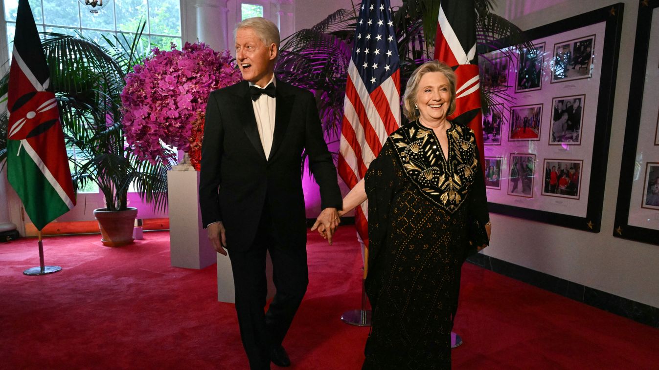 Bill Clinton, 42nd US President and his wife Hillary Rodham Clinton, 67th US Secretary of arrive at the Booksellers Room of the White House on the occasion of the State Dinner with the Kenyan president at the White House in Washington, DC, on May 23, 2024. (Photo by SAUL LOEB / AFP)