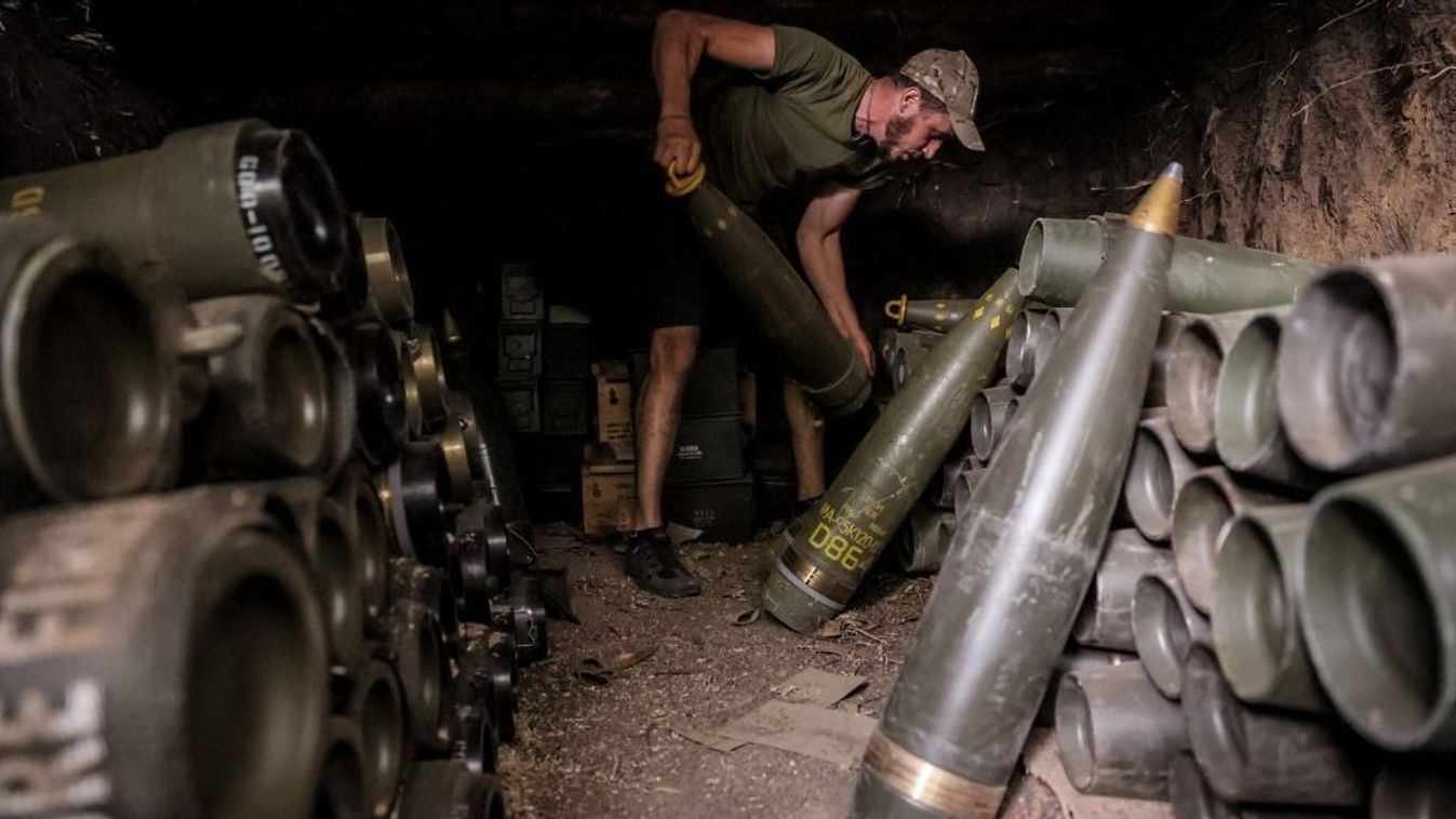 A Ukrainian serviceman of the 24th Mechanized Brigade prepares shells to fire a 155mm M-109 'Paladin' howitzer towards a Russian position on the front line near Chasiv Yar, Donetsk region, on July 20, 2024, amid the Russian invasion of Ukraine. (Photo by Handout / Press service of the 24th Mechanized Brigade / AFP) / RESTRICTED TO EDITORIAL USE - MANDATORY CREDIT "AFP PHOTO / Press service of the 24th Mechanized Brigade" - NO MARKETING NO ADVERTISING CAMPAIGNS - DISTRIBUTED AS A SERVICE TO CLIENTS