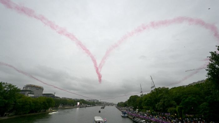 The Patrouille de France draws a heart in the sky during the opening ceremony of the Paris 2024 Olympic Games in Paris on July 26, 2024. (Photo by Damien MEYER / AFP)