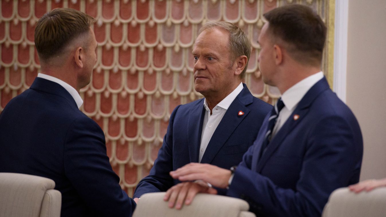 Weekly Ministerial Meeting With Poland's PM Donald Tusk.
Poland's PM Donald Tusk is shaking hands with a minister as he is arriving at the weekly ministerial meeting in Warsaw, Poland, on July 30, 2024. (Photo by Aleksander Kalka/NurPhoto) (Photo by Aleksander Kalka / NurPhoto / NurPhoto via AFP)