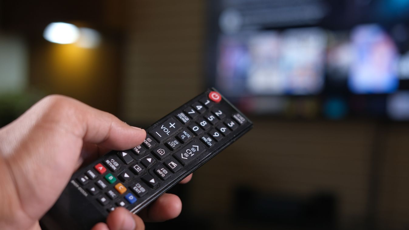 Close,Up,Of,Man,Hand,Holding,Tv,Remote.