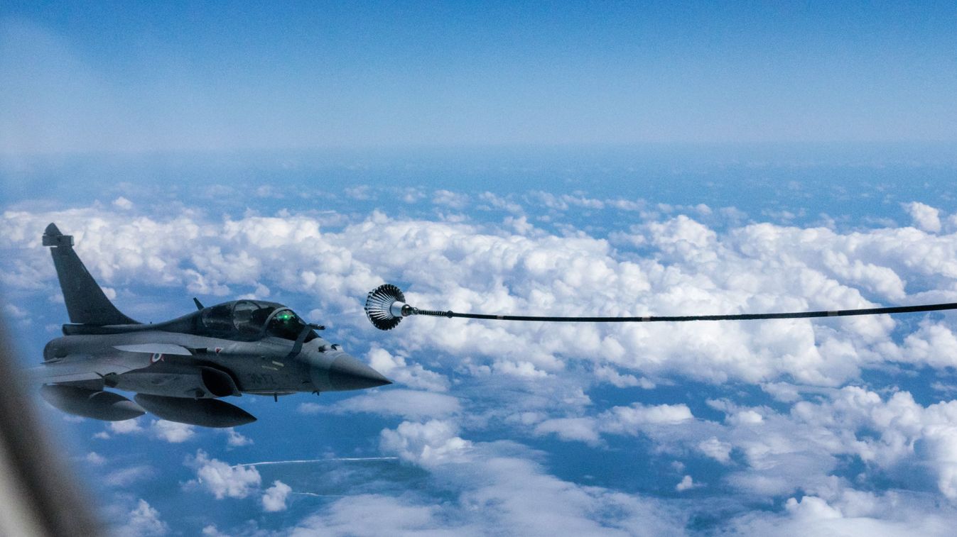 A Dassault Rafale fighter jet is seen from an Airbus A400M Atlas military transport aircraft during a demonstration flight by the French Air Force as part of its Pegase 2024 mission aiming to develop operational partnerships in the Indo-Pacific region, over the Sunda Strait on July 24, 2024. (Photo by Yasuyoshi CHIBA / AFP)